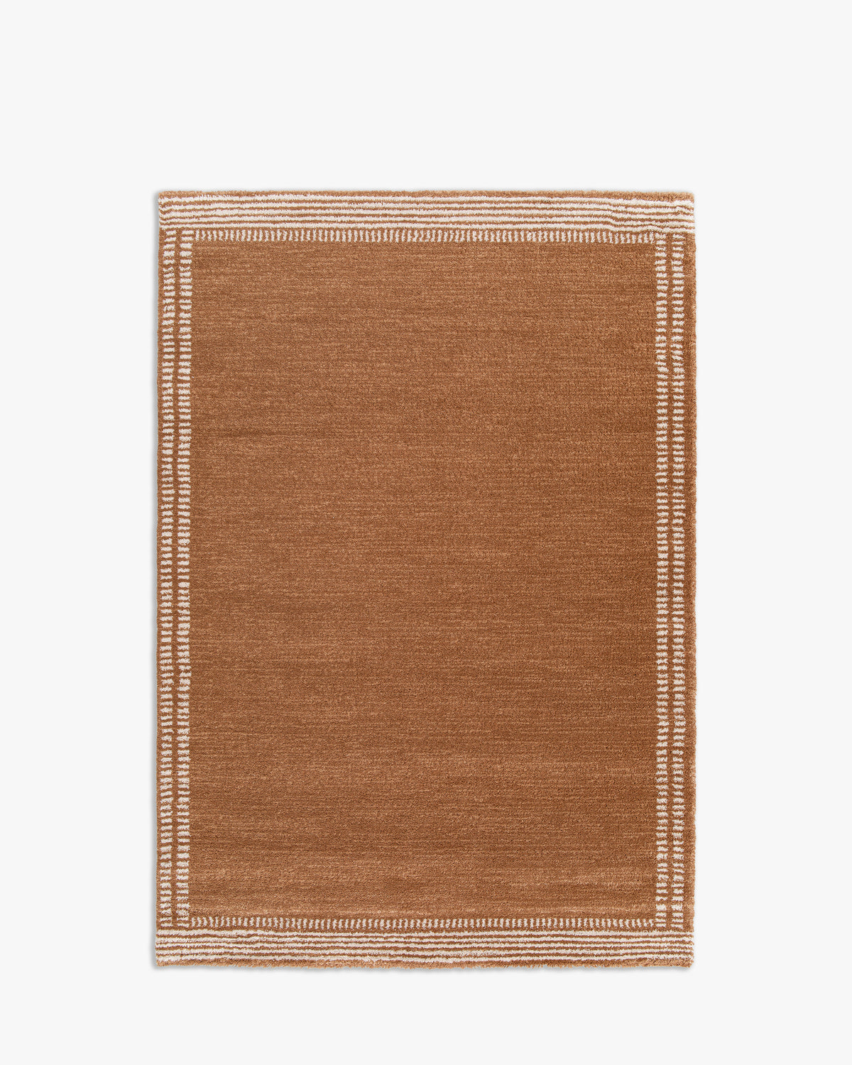 tapis de salon Haven petit format caramel à bordure de tirets écrus - vu de dessus